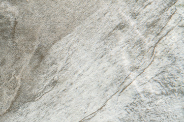 Closeup surface at stone pattern at stone brick wall in the garden textured background