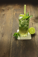 Mojito cocktail with mint leaves and lime