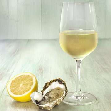 White wine, oyster, and lemon photo with copyspace
