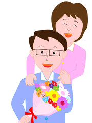 夫に花束を贈る妻