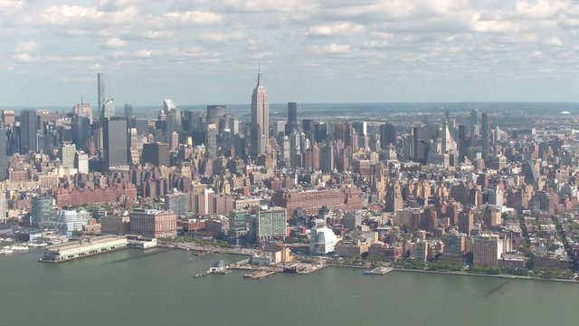 AERIAL: Helicopter on sightseeing tour flying around New York City on sunny day