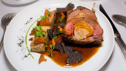 Roast pigeon, stuffed, garnished with black truffle