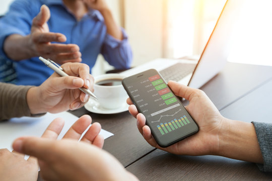 meeting business people team and showing graph screen on phone m - Powered by Adobe