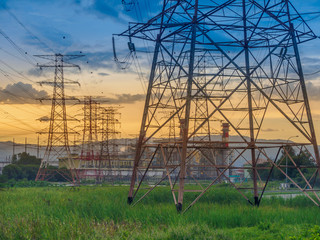 OLYMPUS DIGITwilight photo of High voltage post or High voltage tower in green field and power plant at Butterworth, Penang, MalaysiaAL CAMERA