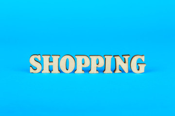 Word from the shopping of wooden letters on a blue background