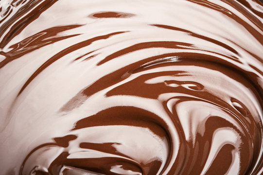 Melted chocolate swirl background.
