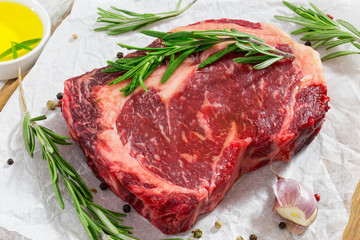 raw beef rib eye fresh meat steak on white paper