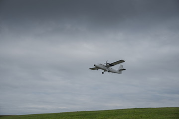 Fototapeta na wymiar Departing aeroplane from the St Mary's Airport on the Isles of Scilly.