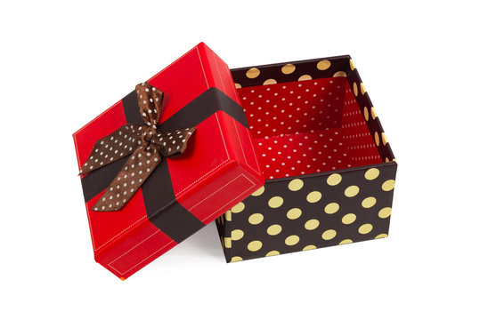 Gift box with red cap and ribbon, isolated on white background.