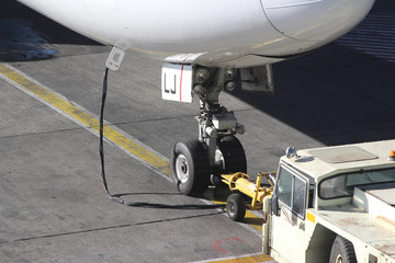 Fore carriage of a modern airplane on asphalt in an airport