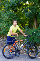 A young guy on a bike outdoors