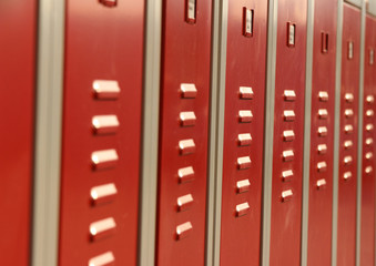 Red colored cabinets to store private belongings on an industrial facility