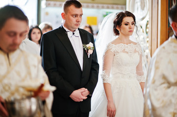 Wedding couple indoor at church enter gate to wedding ceremony.