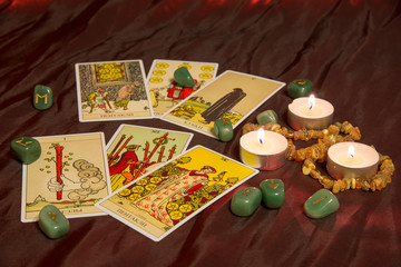 Naklejka na ściany i meble Tarot cards with runes and burning candle