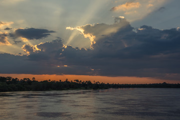 Naklejka na ściany i meble Beautiful Sunset over the Zambezi River, Zambia, The Zambezi is the fourth longest river in Africa