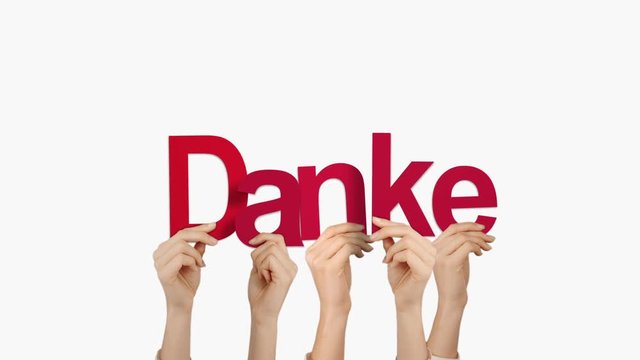 Hands holding up danke