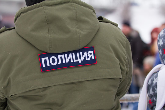 Russian police - emblem on the back OMON at winter day