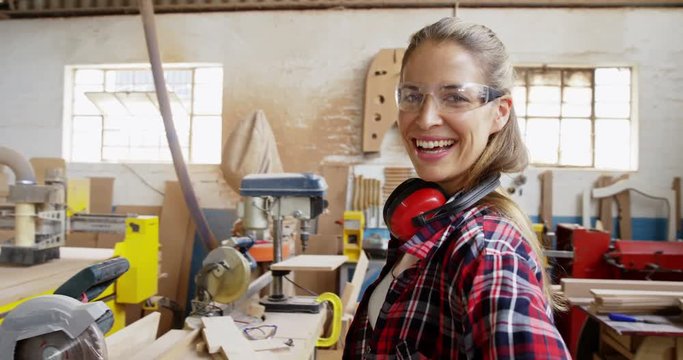 Portrait of attractive carpenter smiling for camera