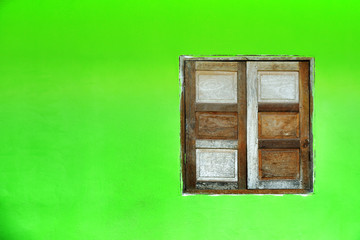 wooden window on the green wall.