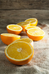 Oranges Fruits and Orange Slice on Wooden Table and Retro Fabric