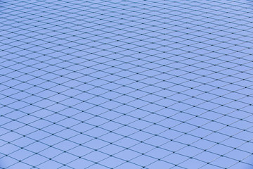 Fototapeta na wymiar practice nets pattern.protective safety net for soccer, football, volleyball, tennis. Selective focus