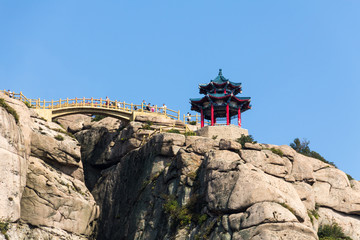 Fototapeta na wymiar Pavilion on the top of Jufeng trail, Laoshan Mountain, Qingdao, China. Jufeng is the highest trail in Laoshan, where visitors can enjoy beautiful aerial views of the landscape