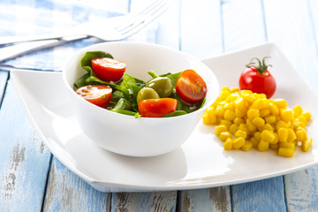 spinach tomato salad food fresh healthy cook rustic wooden background
