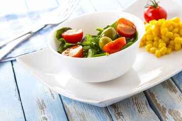 spinach tomato salad food fresh healthy cook rustic wooden background
