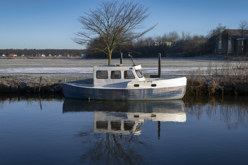 Obraz premium Motorboat on Ribe river in Denmark