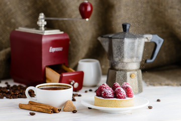 still life in rustic style, fresh tartlet with raspberries and h