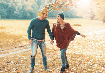 Loving couple in the autumn park. Love and tenderness, lifestyle