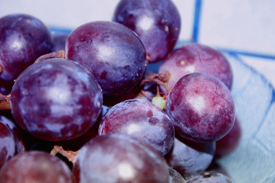 extremly closeup llok on pieces of the grape with water drops