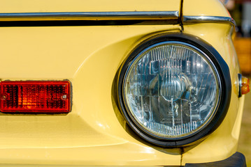 Closeup of old retro car headlight
