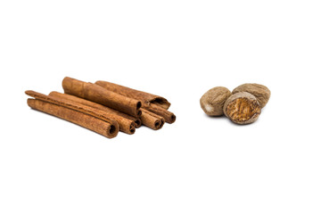 cinnamon sticks and nutmeg isolated on white background
