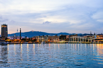 Fototapeta premium Rambla de Mar Port Vell at Sunset. Beautiful peaceful view Barcelona, Spain