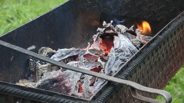Hot cinders in outdoors charcoal grill