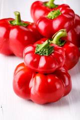 Tomato shaped sweet pepper on white.
