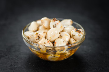 Portion of Garlic (preserved) on a slate slab