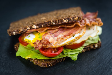 Slate slab with a Bacon and Egg Sandwich