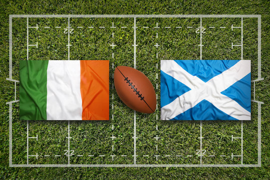 Ireland vs. Scotland..Ireland vs. Scotland flags on rugby field - Powered by Adobe