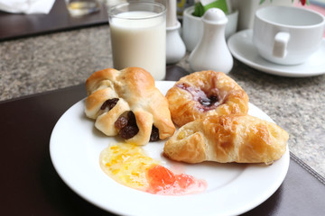 dessert baked or fruit bread on white dish.