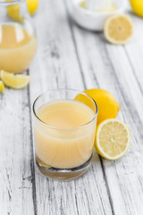 Fresh made Lemon Juice on a rustic background