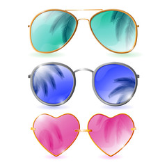 Set of colorful realistic sunglasses with palm reflections on wh