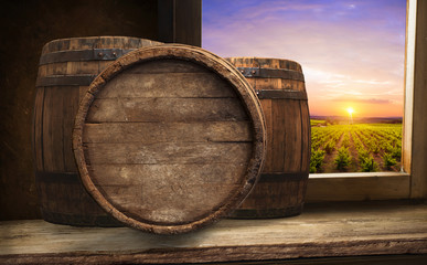 White wine with barrel on vineyard in Chianti, Tuscany, Italy