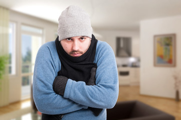 Male in winter clothes inside the house