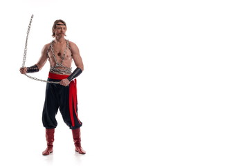 portrait of actor athlete man in trousers with naked torso training with chain on white background
