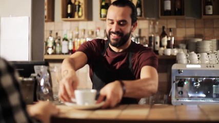 man or waiter serving customer in coffee shop