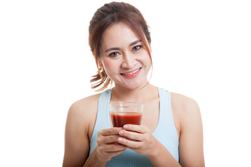 Beautiful healthy Asian girl with tomato juice.