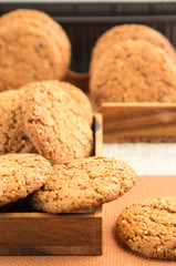 Many of oatmeal cookies in two wooden boxes