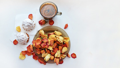 Day of valentina.Romantika.Vnimanie. Tasty dessert. Morning coffee with rose petals. Cakes, coffee, rose petals on white background, space for text heart made of rose petals
